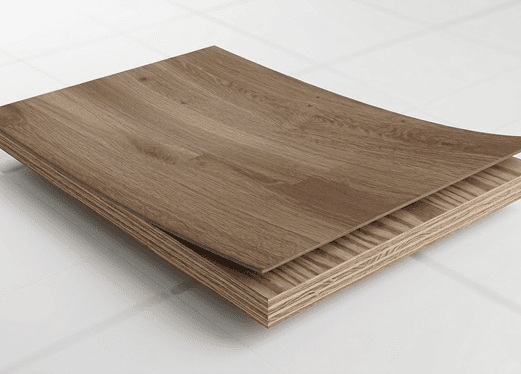 Engineered hardwood planks layered to show plywood core construction