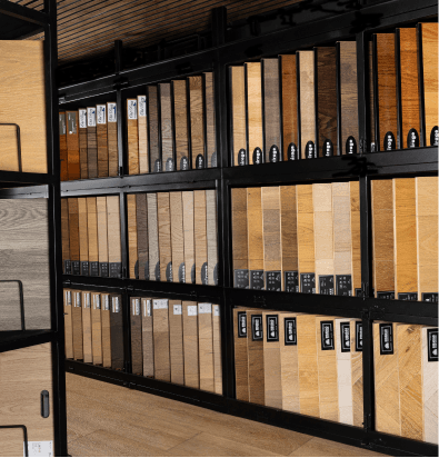 ModiFloors mobile showroom van interior with rows of hardwood and engineered flooring samples